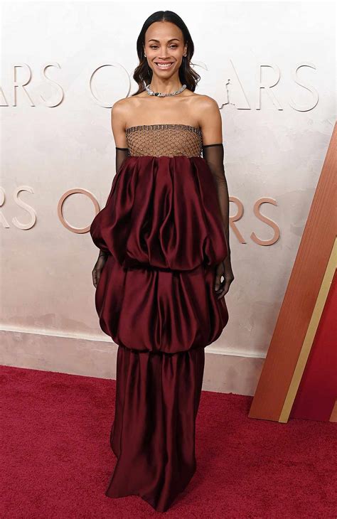 Zoe Saldaña Reinvents Her Wardrobe in Dark Red Ruffled Gown at Oscars ...