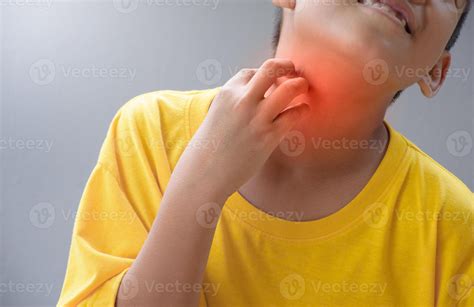 Asian man touching neck due to a sore throat or itchy throat causes of Irritation and infection ...