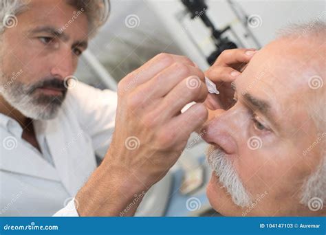 Optometrist Using Mydriatics Eye Drops To Numb Eyes Stock Image - Image of measurement ...
