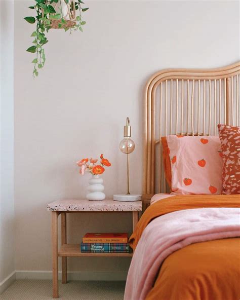 Orange Accented Bedroom With Wood Furniture - Soul & Lane