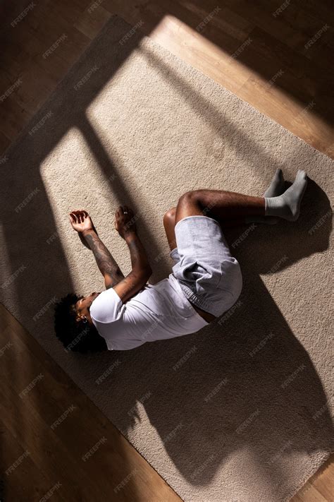 Free Photo | Top view depressed man laying on floor