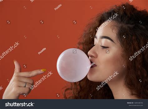 Girl Blowing Bubble Gum