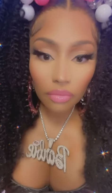 Nicki Minaj reveals 'new boobs' after teasing breast reduction surgery