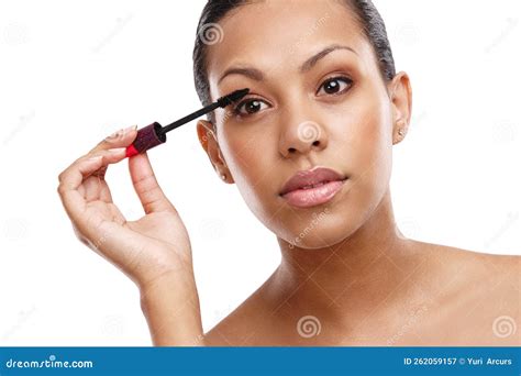 True Beauty Inside and Out. a Gorgeous Young Woman Applying Mascara in ...