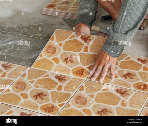 Installing ceramic floor tile hi-res stock photography and images - Alamy