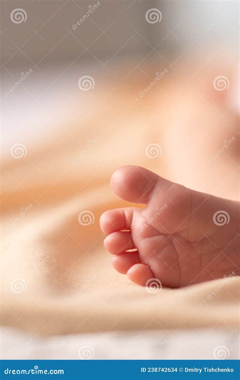 Close Up of Unrecognizable Cute Baby Shaking Feet while Lying in Bed ...