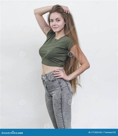 Nice Girl with Beautiful Breasts in a Green T-shirt Posing on Ca Stock ...