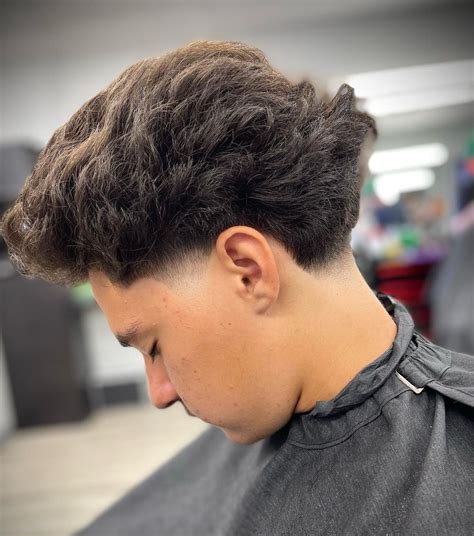 40 Ultra Cool Curly Taper Fade Haircuts for Men in 2025