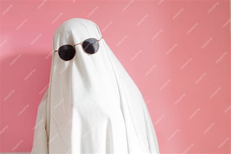 Premium Photo | Sheet ghost costume with sunglasses