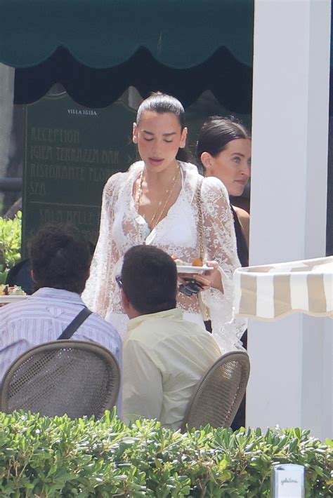 Dua Lipa radiates bridal vibes in white lace dress following wedding to ...