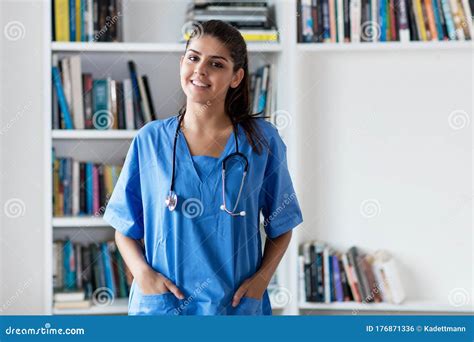 Laughing Young Adult Spanish Female Nurse or Medical Student Stock ...