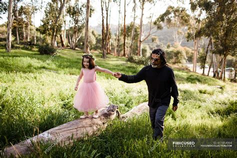 Niece and uncle walking together in field — imagine, hugs - Stock Photo ...