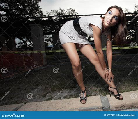 Woman Bending To Strap Her Shoe Stock Image - Image of vogue, glance ...