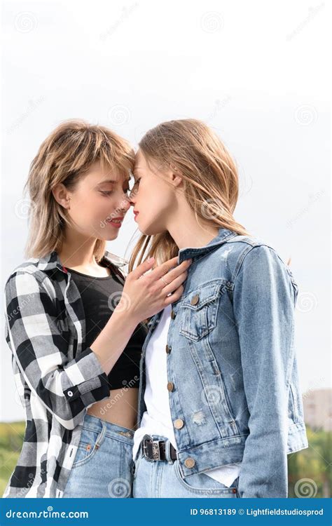 Lesbian Couple Kissing with Eyes Closed Outdoors Stock Image - Image of ...