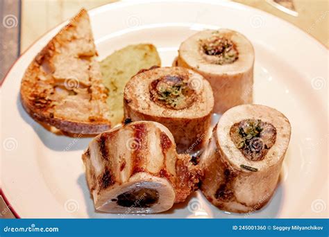 Baked Beef Bones with Bone Marrow are on a Plate Stock Photo - Image of ...
