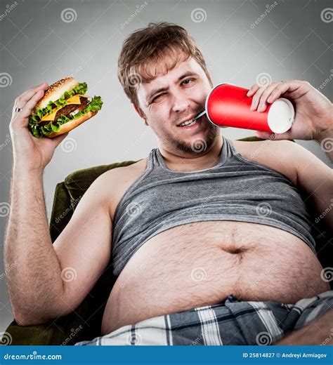 Fat man eating hamburger stock image. Image of armchair - 25814827