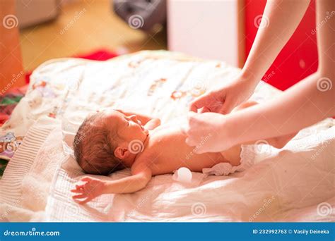 Newborn Cries when Changing a Diaper. Mom Changes Diaper. Baby is ...