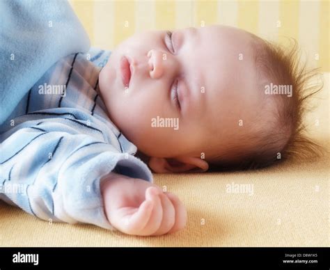Sleeping four week old baby Stock Photo - Alamy
