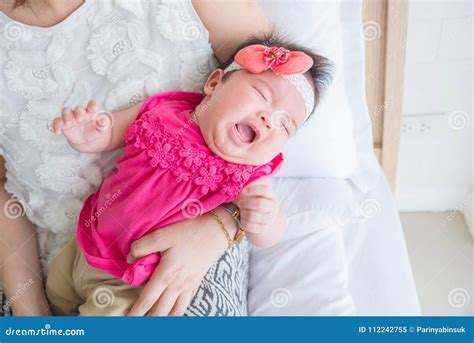 Newborn Crying while Mother Holding in Bedroom Stock Image - Image of ...