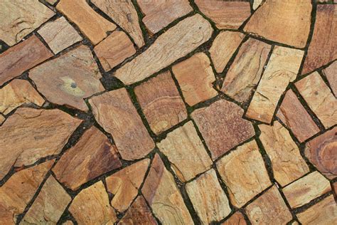 Cobble marble stone paving mosaic texture background. Natural brown ...
