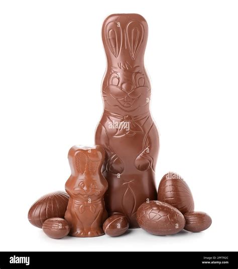Chocolate Easter bunnies with eggs on white background Stock Photo - Alamy