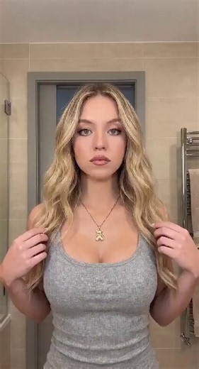 Sydney Sweeney teasing in the steamy bathroom mirror 🔥💦Slowly pulling her tight top down, letting those massive, perfect tits spill out. She knows exactly how hard she’s making us.RT if you’d let her ruin you 👀