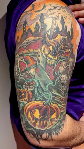 The growing community of enthusiasts donning Zombie Pumpkins inspired tattoos never ceases to amaze me. Dedicated follower Andrew proudly displays this iconic Halloween tableau on his upper arm. Dominating the scene is the Patch Master scarecrow, modeled after my alter ego and pumpkin pattern of the same name. This imposing figure looms over a Halloween Town scene of soaring spires, swirling smoke, and fleeting bats. Oogie’s boys - Lock, Shock, and Barrel - are present and ready for mischief. In