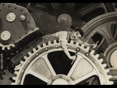 Charlie Chaplin swallowed by machine.