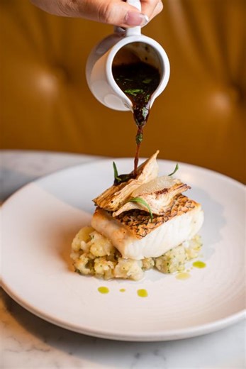 Savour the brilliance of elevated British fare with our Roasted Cod—delicately, fork-tender cod over crushed potatoes, artichoke, and salted capers, elevated by a luxurious red wine and lemon sauce. A taste of timeless elegance awaits. #BreadStreetKitchenSG #MarinaBaySands #Cod | Bread Street Kitchen & Bar | Facebook