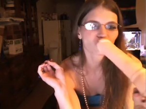 four-eyed-web-camera-cutie-sucks-her-sex-toy-in-front-of-her-web-camera