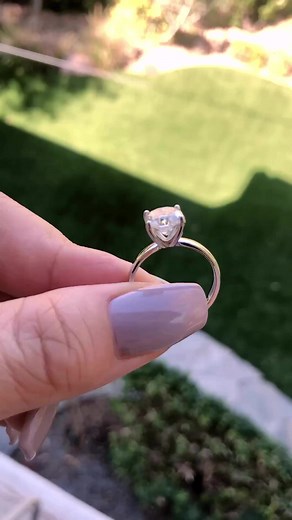 Do you prefer the simplicity of a plain band, or do you prefer an iced out, accented design? #moissanite #engagementring #fireandbrilliance | Fire & Brilliance