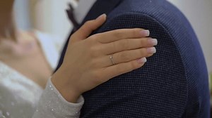 clip-1101097367-bride-groom-hugging-young-couple-love-white