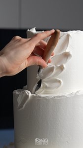 This little beauty features royal icing palette knife petals #cakeart #cakedecorating #cakedesign #fakecake #weddingcake | Rosie's Dessert Spot