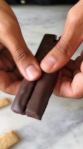 Kit Kat has to be one of my favourite chocolates and I thought why not make them at home from scratch💁🏻‍♂️🥰 This recipe has to be the easiest and foolproof way to make these crispy chocolatey delights ✨Try them and see it become your new favourite instantly🍫🫶🏻 Ingredients Wafers 🍫1/4 cup melted butter 🍫1/4 cup castor sugar 🍫1/4 cup warm water 🍫1 cup whole wheat flour Ganache 🍫1/2 cup dark chocolate 🍫1/4 cup fresh cream, warm 🍫3/4 cup chocolate for dipping Method- 1. For the wafers- 