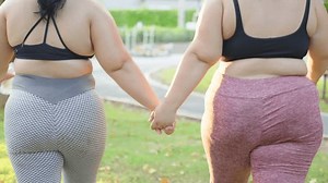 clip-3511139473-closeup-chubby-women-holding-hands-going-workout