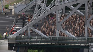 Thousands of naked people walk to the Story Bridge