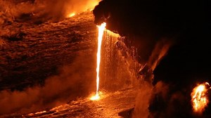 clip-1006904404-lava-running-ocean-volcanic-eruption-on-big