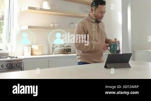Man in the kitchen preparing a mug of hot filtered coffee from a coffee machine. Having breakfast in the morning.