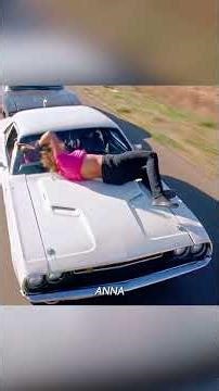 To experience the ultimate thrill, a woman actually strapped herself to the hood of a speeding car.
