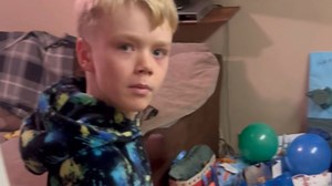 Little boy finds birthday countdown with balloons and presents hard to process