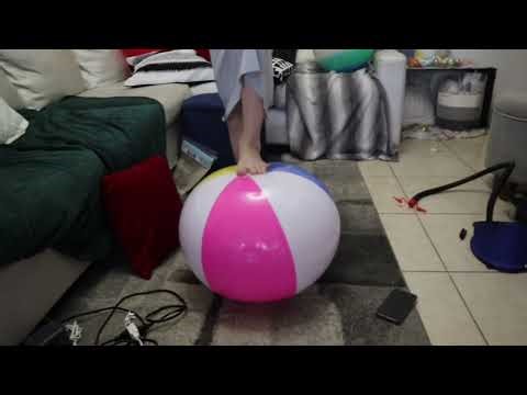 Blowing up and foot popping beach ball