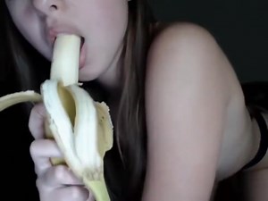 Horny young girl sucks banana (18 )