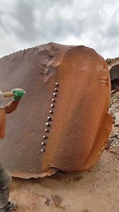 Man breaking a massive rock with nails | Handy Panda