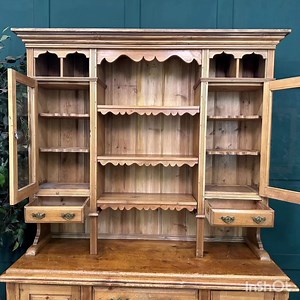 Antique Pine Dresser / Rustic Kitchen Dresser / Farmhouse Dresser / Old Pine Beautiful antique Irish pine kitchen dresser. Base is configured with a bank of three graduating drawers flanked by a small cupboard either side both having open sections to the base, perfect storage for some attractive baskets. Above is a display section with removable shelves to the centre. Either side has glazed cabinet doors. Lots of various sized storage compartments with this dresser which makes it incredibly vers