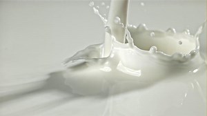 Fresh milk with splashes. Filmed on a high-speed camera at 1000 fps. High quality FullHD footage