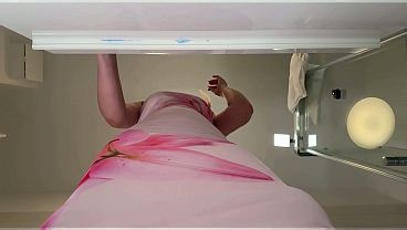 Incredibly hot and sexy authentic redhead with her big tits in the bathroom in a long elegant night dress teases and flashes her private parts