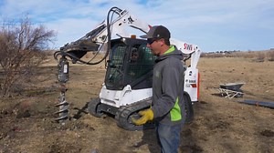 We love this homemade DIY attachment we built to attach to our auger when digging fence post holes! Sometimes the simplest solutions are the best, and we love the way this simple wiper bar clears dirt from around a hole. | SWi Fence & Supply