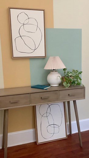 You don’t have to paint a full wall to make a bold impact. All it took was one afternoon and a bit of paint and painters tape to turn an unused area into a fresh spot that we can’t get enough of. #colorblock #roommakeover #beforeandafter #homedecor #accentwall #entryway #paintideas #thehomedepot #painttrends #hometrends #painterstape #trends #dormroomdecor | Crafty Lumberjacks