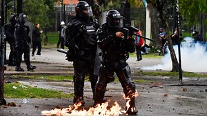 Colombia’s war on gangs as Harry & Meg jet in with cops busting Escobar’s legacy