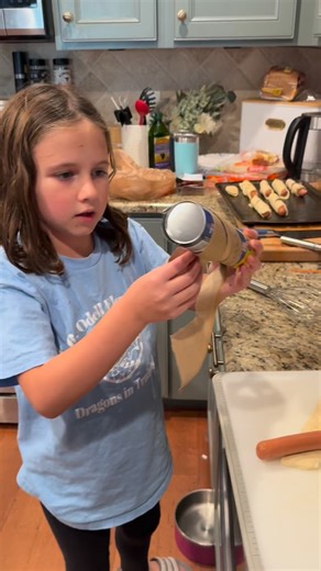 Every Halloween we have Mummy Dogs for dinner and tonight Lucy wanted to make you a video so you can make them too. Ingredients: Hot dogs Crescent Roll Dough Bake according to crescent instructions. | Abby Cornelius